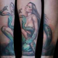 Realism style colored forearm tattoo of woman with big snake