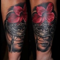 Realism style colored forearm tattoo of woman with mask and flower