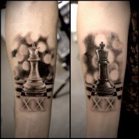 Realism style colored forearm tattoo of chess figures