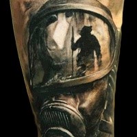 Realism style colored forearm tattoo of human with gas mask