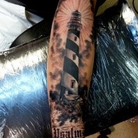 Realism style colored forearm tattoo of big lighthouse and lettering