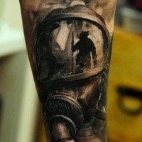 Realism style colored forearm tattoo of man in gas mask