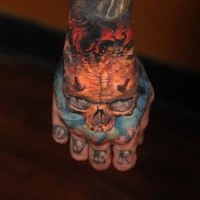 Realism style colored hand tattoo of demons skull with flames
