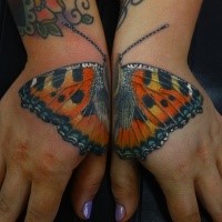 Realism style colored hands tattoo of beautiful butterfly