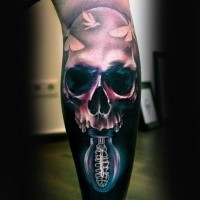 Realism style colored human skull with bulb tattoo on leg