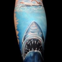 Realism style colored leg tattoo of big shark and swimming woman