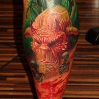 Realism style colored leg tattoo of devil face with skeleton