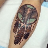 Realism style colored leg tattoo of dream catcher tattoo with elephant