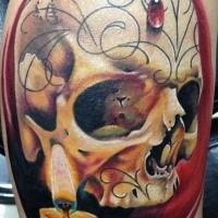 Realism style colored leg tattoo of human skull with candle and jewelry