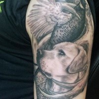 Realism style colored shoulder tattoo of hunter dog with wild bird and deer horn
