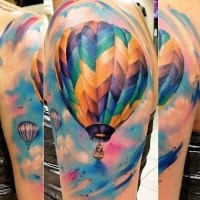 Realism style colored shoulder tattoo of flying balloon