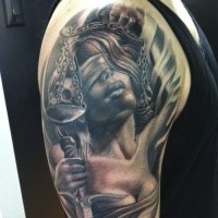 Realism style colored shoulder tattoo of Justice woman