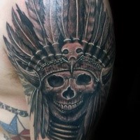 Realism style colored shoulder tattoo of demonic skull with Indian helmet