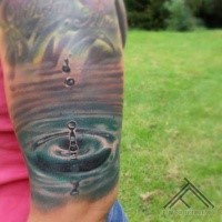 Realism style colored shoulder tattoo of water drop