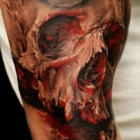 Realism style colored shoulder tattoo of bloody skull