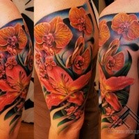 Realism style colored shoulder tattoo of various flowers