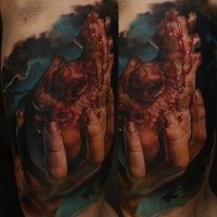 Realism style colored tattoo of bloody human heart