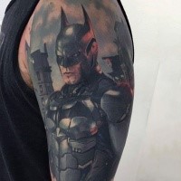 Realism style colored very detailed cool looking Batman tattoo on upper arm