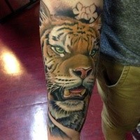 Realism style colored very detailed tiger with small flowers