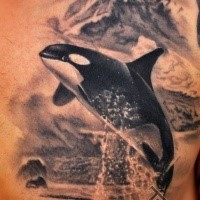 Realism style cool looking side tattoo of big whale and mountain