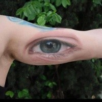 Realism style very detailed biceps tattoo of human eye