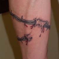 Realistic barbed wire forearm tattoo