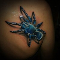 Realistic blue spider tattoo