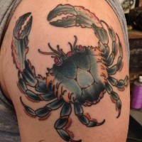 Realistic crab tattoo on males arm
