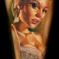 Realistic detailed and colored seductive sexy woman tattoo on arm