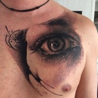 Realistic eye tattoo on chest for men