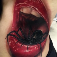 Realistic frightful spider in mouth tattoo