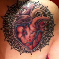 Realistic heart with mandala tattoo by Rob Hunt