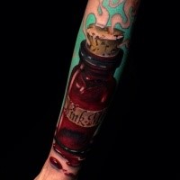 Realistic looking arm tattoo of little bottle with lettering