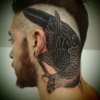 Realistic looking big black ink bird tattoo on head