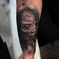 Realistic looking black and white 3D forearm tattoo of monster woman face