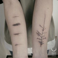Realistic looking black ink designed by Zihwa forearm tattoo of various trees