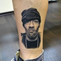 Realistic looking black ink forearm tattoo of man portrait