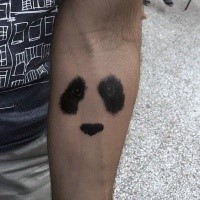 Realistic looking black ink forearm tattoo of panda bear face
