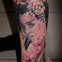 Realistic looking colored beautiful Asian woman portrait tattoo combined with pink flowers
