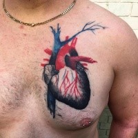 Realistic looking colored chest tattoo of human heart