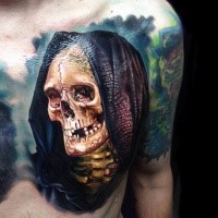 Realistic looking colored chest tattoo of skeleton with hood