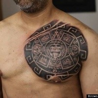 Realistic looking colored chest tattoo of Mayan calendar