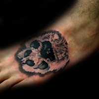 Realistic looking colored foot tattoo of dog paw print