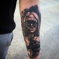 Realistic looking colored forearm tattoo of smoking woman with pistol