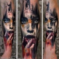 Realistic looking colored forearm tattoo of scary woman