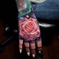 Realistic looking colored hand tattoo of pink rose