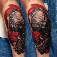 Realistic looking colored leg tattoo of creepy evil Venom