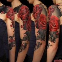 Realistic looking colored shoulder and arm tattoo of big roses