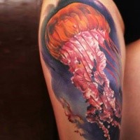 Realistic looking colored thigh tattoo of big jellyfish