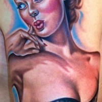 Realistic looking colored vintage pin up girl tattoo on leg